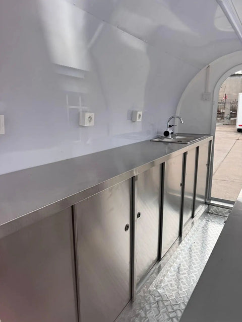 Interior view of Custom Designed Concession Food Truck Trailer With Turnkey Kitchen Layout And Heavy Duty Stainless Steel Body, featuring stainless steel setup.
