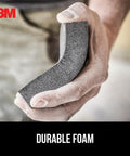 Person holding Dual Grit Drywall Sanding Sponge For Medium Remove And Fine Smooth Flexible Foam Block angled view