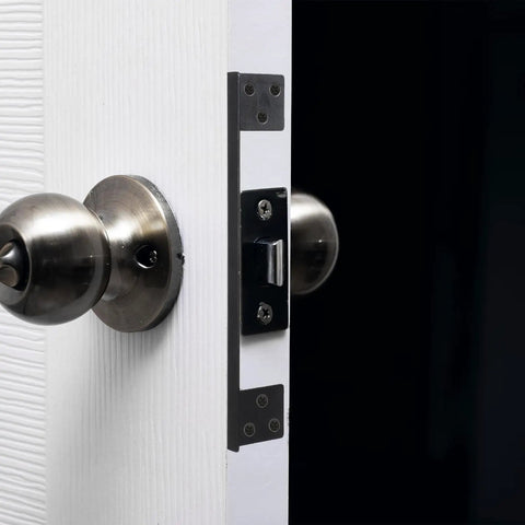 Close-up of Heavy Duty Outswing Door Latch Guard Cover Kickproof Black Steel Striker Plate for Deadbolt security on a door.