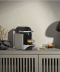 Pixie Original Espresso Machine Titan Finish For Home Use With Quick 25 Second Heat Up Two Programmable Buttons And Auto Flow Stop Energy Saving Auto Shutoff Barista Quality Espresso At Home Without The Fuss on a countertop with cups