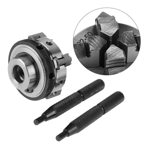 Top Shelf 4 Jaw Reversible Self Centering Lathe Chuck With M14 Thread Mount And 50mm Jaw Capacity on workshop surface with chuck keys.