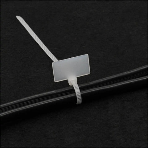 Rock Solid 100 Pack Nylon Self Locking Cable Ties With Write On Labels securing bundled cables with a writable label.