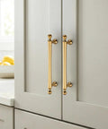 Five Pack Champagne Bronze Cabinet Pulls, 5 Inch Center To Center Kitchen Handles For Cabinets And Dressers, Zinc Alloy on grey doors