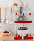 Heavy Duty T Handle Fruit Wine Press With Dual Stainless Steel Barrels, straight up rock solid manual grape press on kitchen counter.