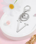 Custom Initial V Keychain In Stainless Steel Key Ring Silver Alphabet Charm For Women And Men on decorative tray