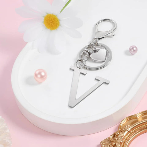 Custom Initial V Keychain In Stainless Steel Key Ring Silver Alphabet Charm For Women And Men on decorative tray