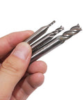 Close-up of AFUNTA 4-flute HSS end mills with straight shanks held in hand (three cutters)
