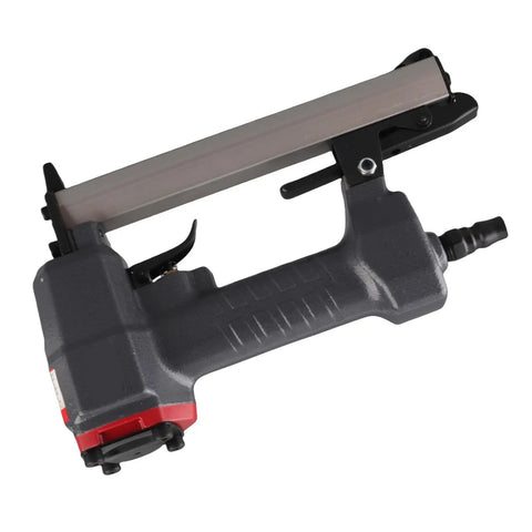 Heavy Duty Pneumatic Brad Nailer With 100 Nail Capacity And Slick Jam Clearing Tech For Smooth Carpentry Woodworking And Diy Projects, angled view showing trigger and loading area.