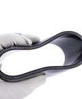 Hand holding Beefy 4 Inch ID Silicone Coupler Reinforced Hose 4-Ply, showing inner structure, black heavy duty high temp material