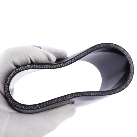 Hand holding Beefy 4 Inch ID Silicone Coupler Reinforced Hose 4-Ply, showing inner structure, black heavy duty high temp material
