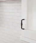 Installed Oil Rubbed Bronze Granby Cabinet Pull 3 Inch Center To Center Drawer Handle on white kitchen cabinet