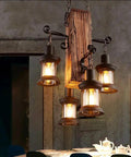 Industrial Vintage Wooden Hanging Pendant Light With Four Lantern Bulbs in a rustic cafe setting.