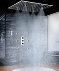 Heavy Duty 20X40 Inch Shower Panel System With Solid Three Knob Thermostatic Mixer And Four Mode Settings Like Rainfall Mist Massage Jets Plus Independent Hand Shower In Classic Antique Brass For A Straight Up Bathhouse Vibe in a modern shower setting with overhead rain and body sprays.