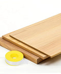 High Temp PTFE Sealing Tape Thread Sealant For Water Leaks, Pipe Tape For Faucets next to wooden boards