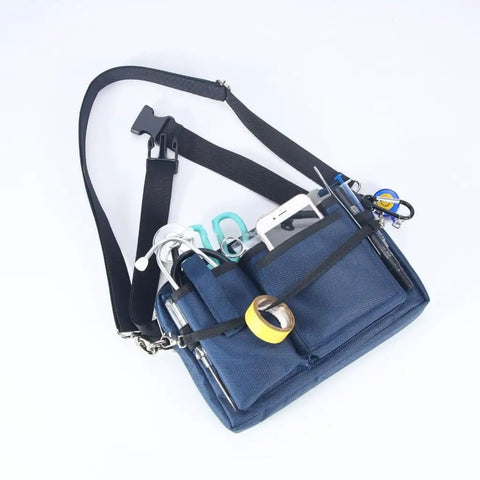 Heavy Duty Utility Waist Pack With Modular Tool Dividers And Waterproof Zippers For Job Site Hustlers Seeking Kick Ass Storage For Drill Bits Pliers And Pro Gear Built Tough As Nails Every Single Shift, navy tool organizer with various tools visible.