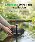Person placing Floating Solar Water Fountain With Six Nozzles For Garden Pond Pool And Outdoor Use Upgraded 2026 in pond