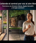 Woman using Hue White And Color Ambiance Outdoor LightStrip 2m 7ft All Weather, controls light with voice command via smart hub