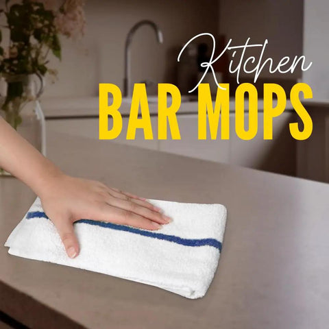 Person using a kitchen mop towel on a countertop. Value Pack Of 36 Absorbent 16x19 Inch Terry Cloth Cleaning Rags For Home And Business.