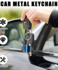 Hella Dope Two Pack Gearbox Keychain Featuring Six Speed Manual Shifter Shape With Transmission Stick Keyring in hand near car door.