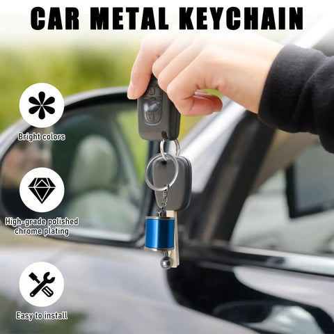 Hella Dope Two Pack Gearbox Keychain Featuring Six Speed Manual Shifter Shape With Transmission Stick Keyring in hand near car door.
