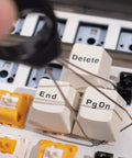 Close-up of Two Layer Switch Lubrication Station for Mechanical Keyboards, showing keycap puller with Gateron switch keycaps.