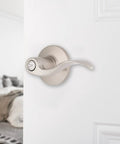 Six Pack Satin Nickel Privacy Locking Wave Door Levers For Interior Doors on white door, transitional bed bath setup visible