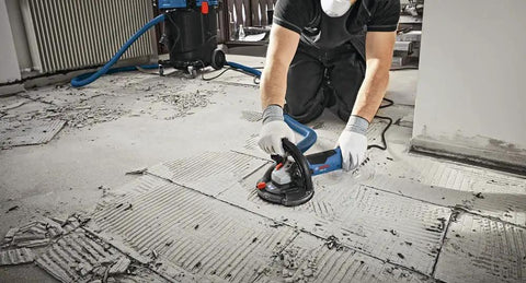 Worker using 5 Inch Diamond Cup Grinding Wheel For Concrete With Double Row Segments, Optimized Bond For Longer Life