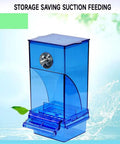 Total Game Changer Automatic Bird Feeder With Clear Acrylic Bowl For Parrots, blue suction feeding unit with easy-access drawer.