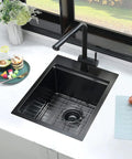 15 Inch Drop-In Bar Sink Workstation With Solid Wood Cutting Board in black stainless finish in kitchen counter setting.