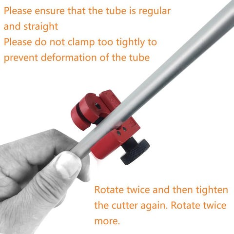 Brake line flaring tool with red clamp and black knob gripping a silver metal tube, hand holding tube