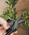 Person using 6.6 Inch Stainless Steel Curved Pruning Shears 2 Pack With Micro Tip Dope Lightweight Ergonomic Grip, Nonstick Teflon Coated Blades for trimming plant