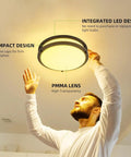 Person installing 13 Inch Flush Mount LED Ceiling Light Fixture With Adjustable 2700K To 5000K Color Temperature in ceiling