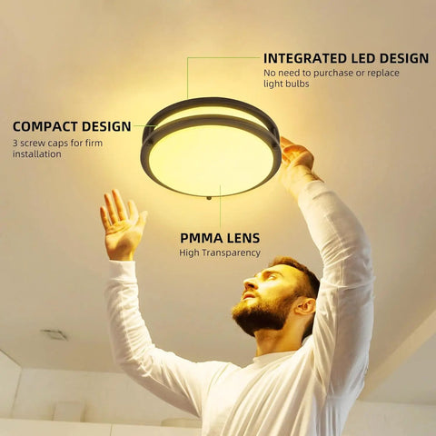 Person installing 13 Inch Flush Mount LED Ceiling Light Fixture With Adjustable 2700K To 5000K Color Temperature in ceiling