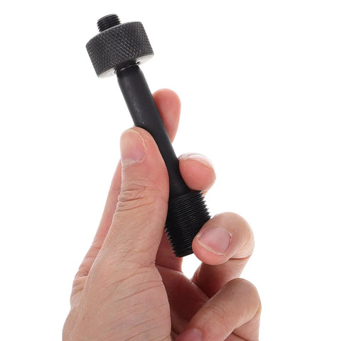 Close-up of a hand holding a component from the Heavy Duty Hydraulic Punch Driver Kit With Tie Rod And Lock Nut For Metal Hole Punching