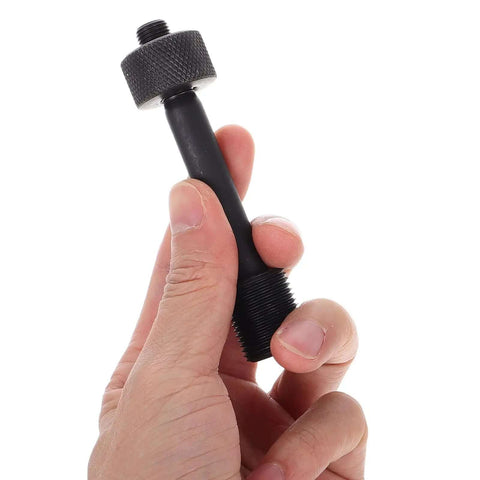 Person holding a component from the Heavy Duty Hydraulic Hole Punch Driver Kit With Locking Rod Cap for Metal Sheet Punching and Electrical Conduit Holes.
