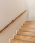 Premium Solid Wood Stair Handrail 2 Foot Wall Mounted Guardrail Built Like A Tank For Indoor Outdoor Safety along a staircase.