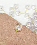 Clear push pin from Gold Paper Clips And Binder Clips Set 154 Pcs Must Have Office Supplies Bundle on a cork board