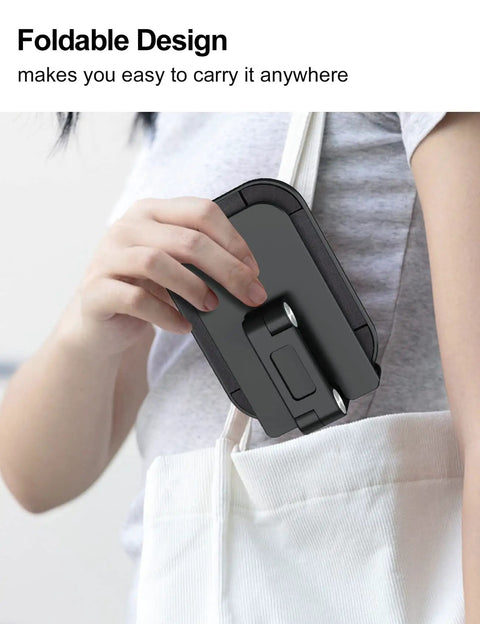 Person placing black adjustable height folding phone stand in a bag, highlighting portability and compact design.