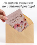 Hand holding Bentley Pollinator Mix Ready-To-Sow Wildflower Seeds Packets For Butterfly Gardens in envelope
