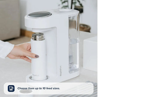 Zero Drama Instant Boiling Water Dispenser And Rapid Chill Formula Preparation Machine with a white bottle being placed.