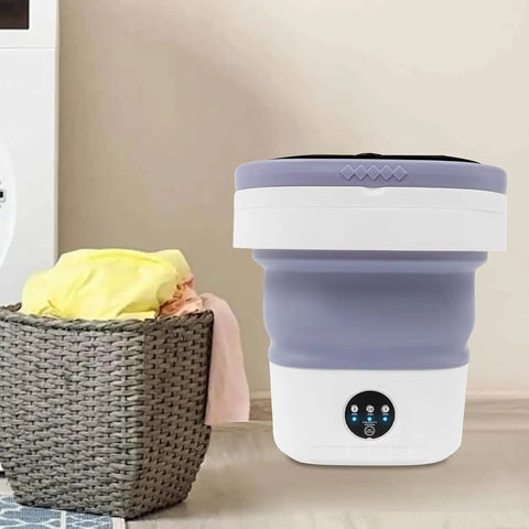 Hella Efficient Compact Foldable Mini Washer With Slick Drainage Setup And Pure Copper Motor Plus Gentle Handwash Simulation For Delicates And Baby Clothes Green Finish in a laundry room setting.