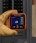 TI250 Rechargeable Thermal Imaging Camera With 19,200 Pixel Resolution And Three Color Palettes held by a gloved hand for electrical panel inspection