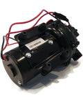 Rock Solid 12 Volt Diaphragm Pump Cracking Out Four Gpm For Zero Sweat Fluid Moving And Crop Spraying With Self Priming Capability Hooked To One Half Inch Npt Ports Pushing Sixty Psi Pressure close-up view of diaphragm pump with wires and ports