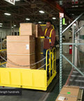 Rock Solid 54 Inch Wide Mobile Work Platform Safety Cage For Forklifts And Fork Trucks Job Ready Rig showcases a worker transporting boxes.