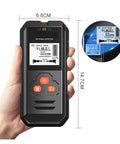 Rock Solid Black Metal Detector And Stud Finder With HD Backlit LCD Screen held in hand showing exact deep measurement and buttons.