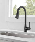 Precept Pull-Down Kitchen Faucet, 1.5 GPM, Matte Black Finish, installed in a modern kitchen setting