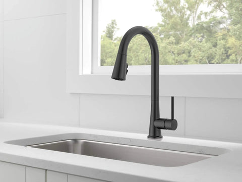 Precept Pull-Down Kitchen Faucet, 1.5 GPM, Matte Black Finish, installed in a modern kitchen setting