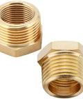 Two brass NPT reducer fittings, 1-inch male to 3/4-inch female, hex threaded adapters, front view
