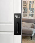Two Sets 12 Inch Stainless Steel Door Handles For Wall Mounted Push Pull Plates With Screws shown on a white door in a living room