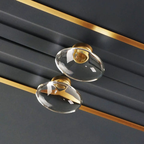 Close-up of 16 Pack Glass Cabinet Knobs And Pulls Dope Oval Crystal Knobs For Dressers And Cabinets Satin Brass Gold Finish installed on cabinet